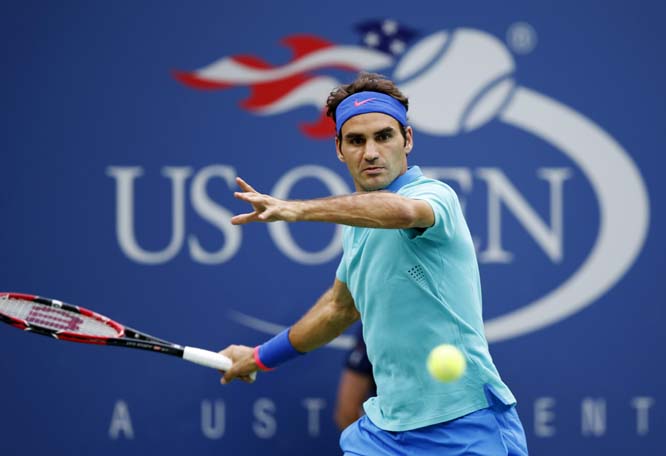 Roger Federer of Switzerland returns a shot against Marcel Granollers of Spain during the third round of the 2014 US Open tennis tournament in New York on Sunday.