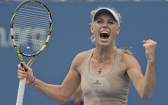 Caroline Wozniacki celebrates her 3-set victory over Maria Sharapova at US Open on Sunday.