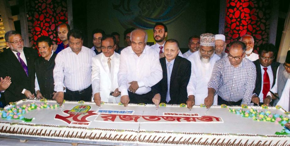 Housing and Public Works Minister Engineer Mossaraf Hossain cutting cake as chief guest at GEC Convention Centre on the occasion of the 25th founding anniversary of Bonoful Group yesterday.