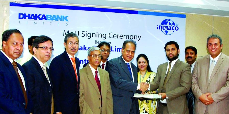 Niaz Habib, Managing Director of Dhaka Bank Limited and Md Irad Ali, Deputy Managing Director of Intraco Limited sign a Memorandum of Understanding on Wednesday at bank's head office to distribute 10,000 prepaid SIM cards with 10 Saudi real balance among