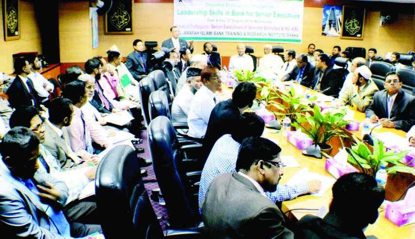 Chairman and Managing Director of Rapport Bangladesh Limited, Dr M Mosharraf Hossain is seen to conduct a training workshop on 'Leadership Skills in Bank' for the top and senior executives of Al-Arafah Islami Bank Limited at the board room of the bank i