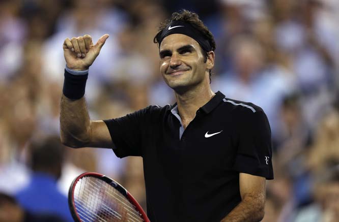 Roger Federer of Switzerland smiles and flashes a thumb up after defeating Roberto Bautista Agut of Spain 6-4, 6-3, 6-2 during the fourth round of the 2014 US Open tennis tournament on Tuesday in New York.