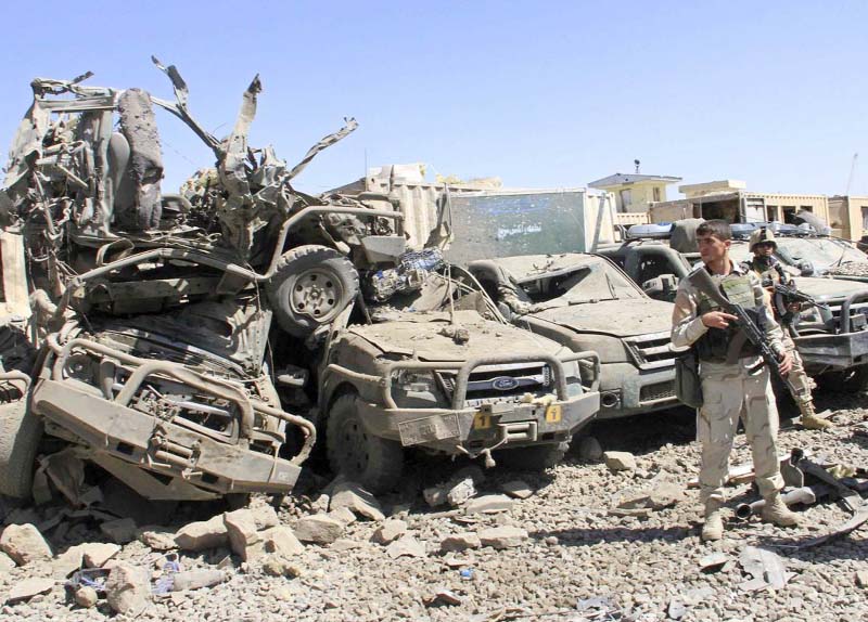 Members of the Afghan security force keep watch at the site of a suicide bomb attack in Ghazni Province on Thursday.