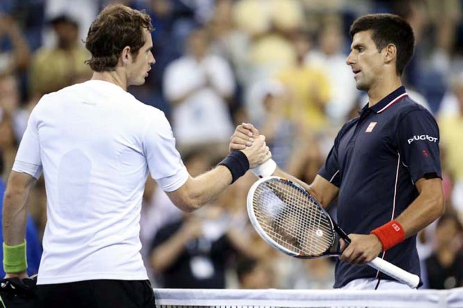 Novak Djokovic (right) of Serbia clasps hands with Andy Murray of Britain at the net after a quarterfinal of the US Open tennis tournament early on Thursday in New York. Djokovic won 7-6 (1), 6-7 (1), 6-2, 6-4.