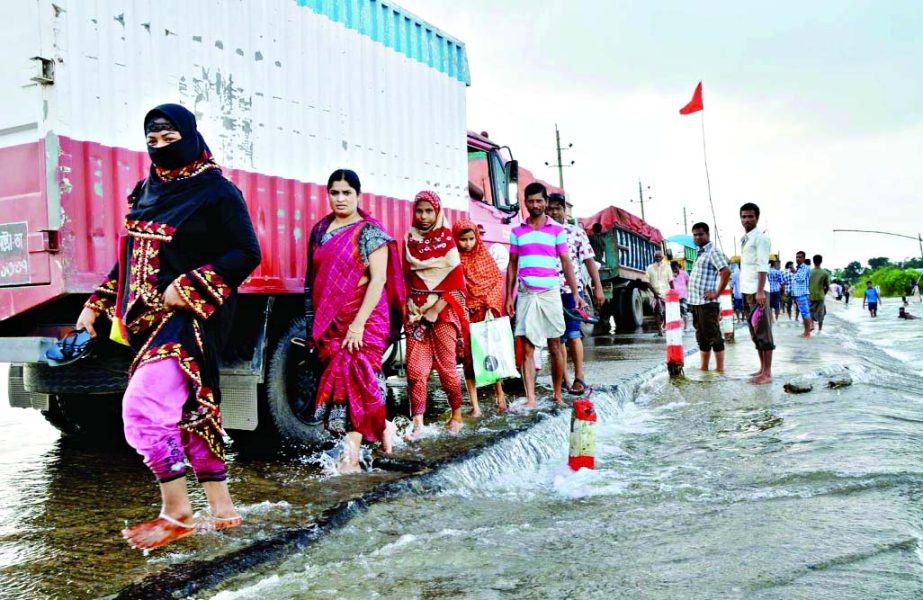 Sherpur-Jamalpur Diversion Road remained inundated following onrush of waters from upstream affecting the movement of vehicles and local commuters at Char Pakkhi Janurpar points on Friday.