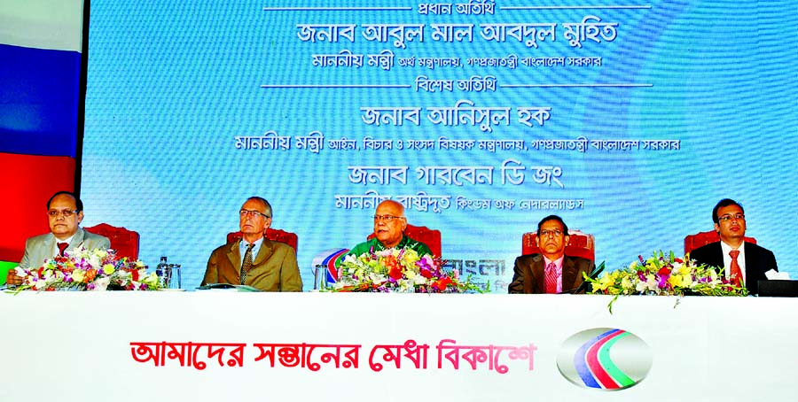 Finance Minister Abul Maal Abdul Muhith handing over scholarship letters among the 5,050 meritorious SSC equivalent pass students at Shaheed Suhrawardi Indoor Stadium, Mirpur, Dhaka on Saturday. Law, Justice and Parliamentary Affairs Minister Anisul Huq