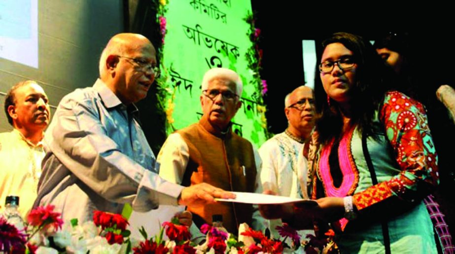 Finance Minister Abul Maal Abdul Muhith distributing certificates among the SSC and HSC passed students at a function organized by Jalalabad Association at BIAM Auditorium in the city on Friday.