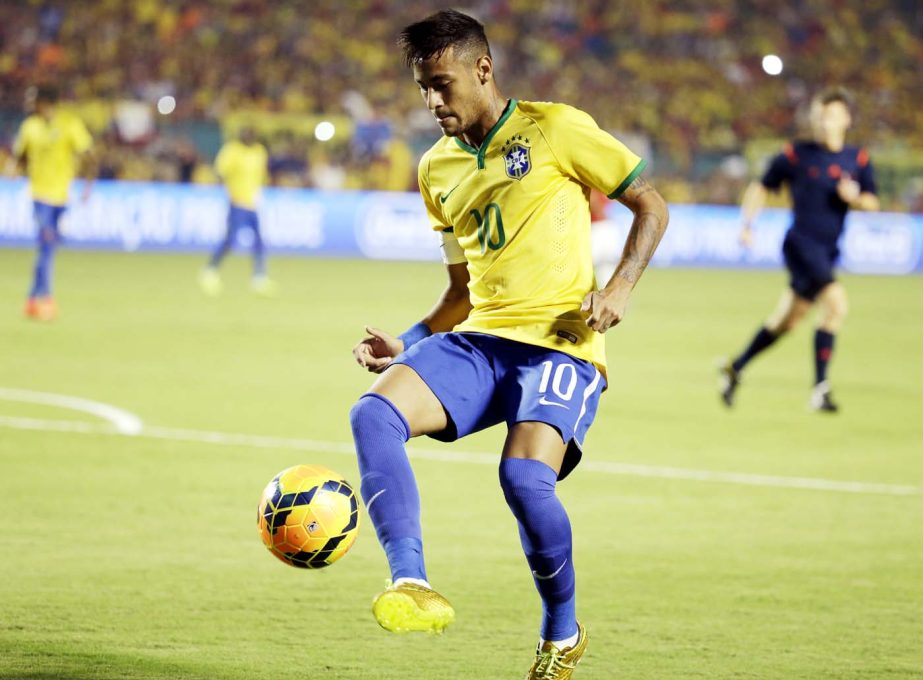 Brazil's Neymar controls the ball in the first half of an international friendly soccer match against Colombia on Friday in Miami Gardens, Fla.