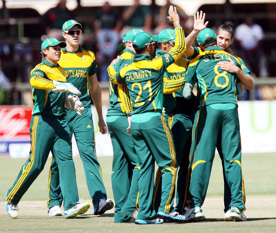Wayne Parnell is congratulated after a wicket during the tri-series final between Australia and South Africa at Harare on Saturday.