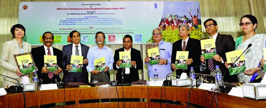 Planning Minister AHM Mostofa Kamal, along with other distinguished guests holds the copies of the report on 'Millennium Development Goals: Bangladesh Progress -2013' at its launching ceremony organised by General Economics Division of the Planning Comm