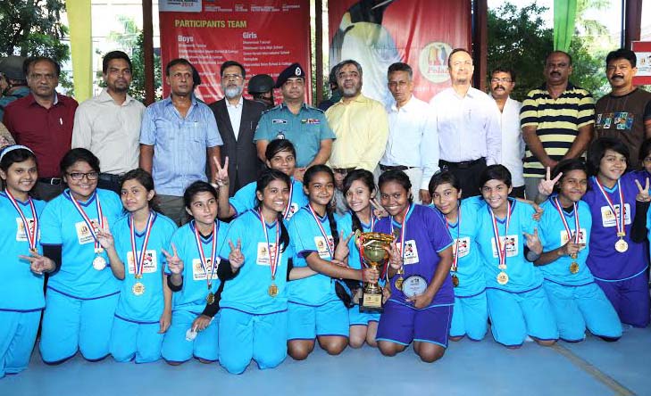(Left) Saint Gregory's High School, the champions of the Boys' Group of the Polar Ice cream 22nd School Handball Tournament and (right) Viqarunnisa Noon School & College, the champions of the Girls' Group of the Tournament pose for a photo session with