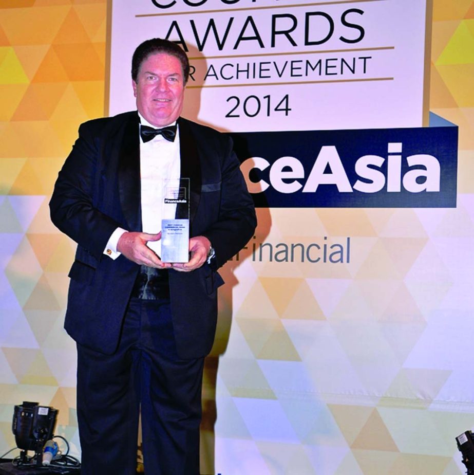 Jim McCabe, CEO of Standard Chartered Bank Bangladesh receiving the "Best Foreign Commercial Bank in Bangladesh" award from FinanceAsia, a financial publication, at a Singapore hotel recently.