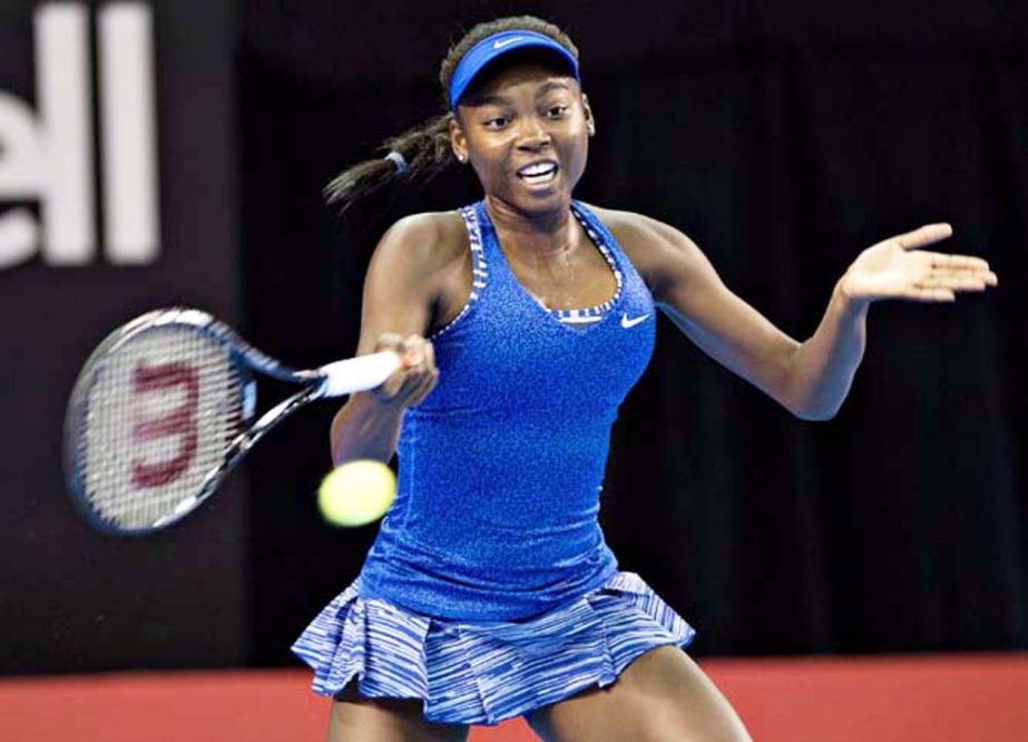 Francoise Abanda of Canada returns to Venus Williams of the United States during the first round of the Banque Nationale tennis tournament in Quebec City on Tuesday.