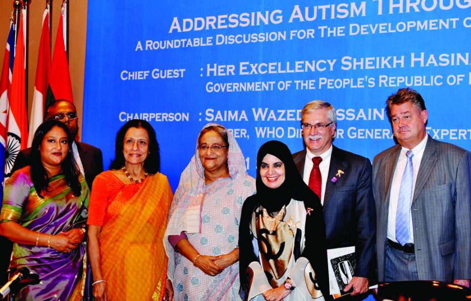 Prime Minister Sheikh Hasina at a photo session after a discussion on 'Addressing Autism Through Partnership' as a side event of the 32nd Meeting of Ministers of Health of the WHO South-East Asia Region in the city's Sonargaon Hotel on Thursday. BSS ph