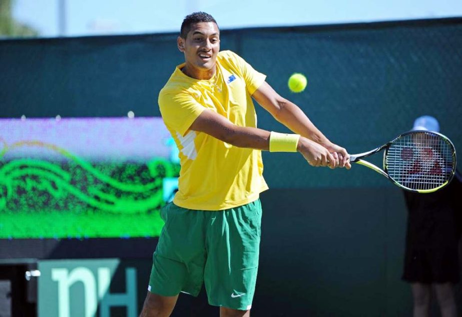 Nick Kyrgios plays a backhand return against Denis Istomin in the Davis Cup World Group play-off tie in Perth on Friday.