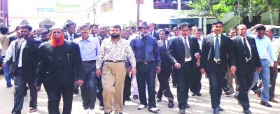 NETRAKONA: Lawyers of Netrakona District Bar Association brought out a procession at Judge Court premises demanding removal of the district judge Mohammad Amirul Islam on Thursday.