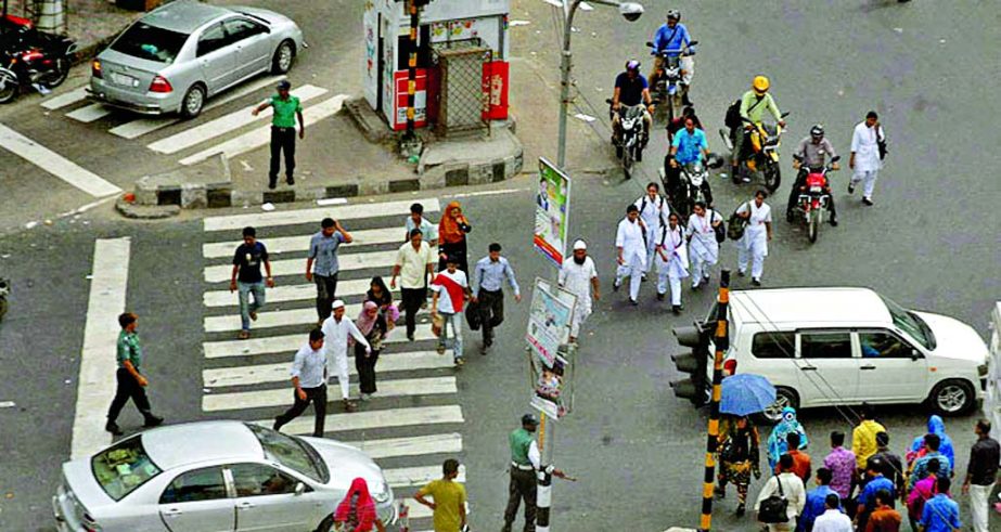 Free for all: Vehicles and pedestrians moving haphazardly in Shahbagh area on Saturday ignoring the footover bridge (not in the picture) nearby amid security concern.