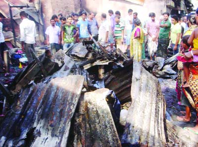 BARISAL: A view of devastating fire that gutted business enterprises at Agoiljhara upazila on early Saturday.