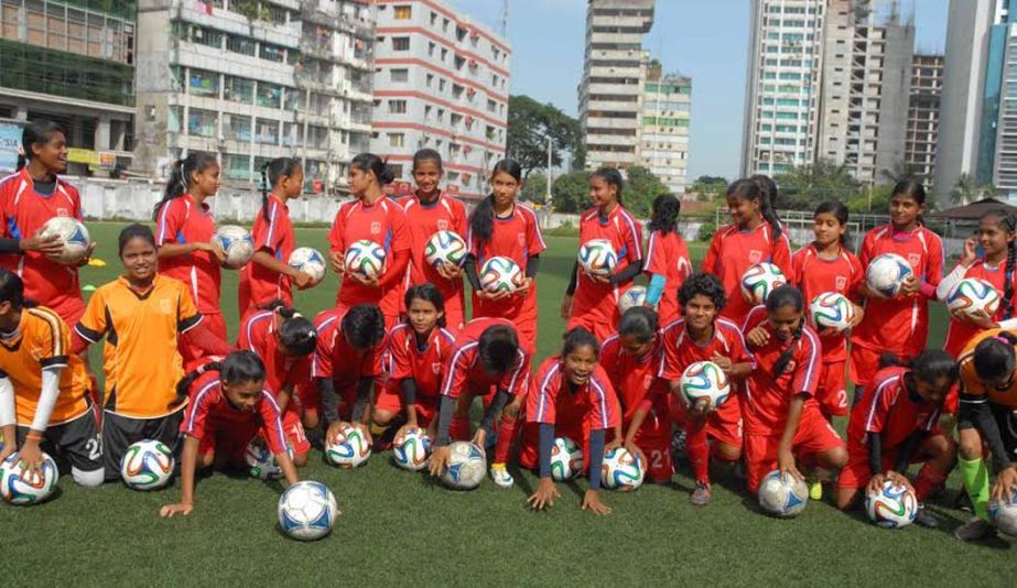 Members of Bangladesh Under-16 National Women's Football team pose for a photograph at the BFF Artificial Turf on Sunday.