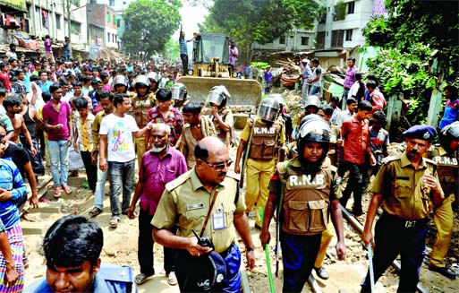 Railway authority evicted unauthorised structures from their land along the rail lines in city's Moghbazar area on Sunday.