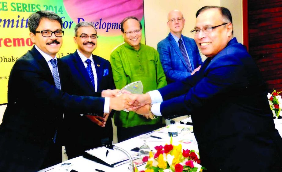 State Minister for Foreign Affairs Md Shahriar Alam handing over "Financial Branding Award" to Helal Ahmed Chowdhury, Managing Director of Pubali Bank Limited, organized by Centre for Non-Resident Bangladeshis at a city hotel recently. BB Governor Dr At