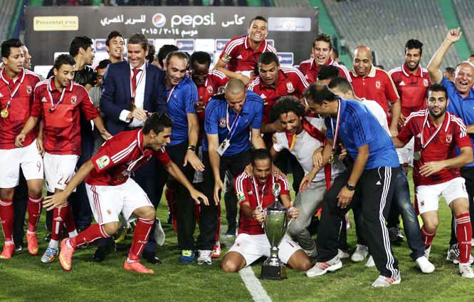 Al Ahly players celebrate winning the Egyptian Super Cup soccer match against Zamalek at the Cairo International Stadium in Cairo, Egypt on Sunday. The Egyptian football association (EFA) said that fans of Al Ahly and Zamalek clubs will not be allowed to