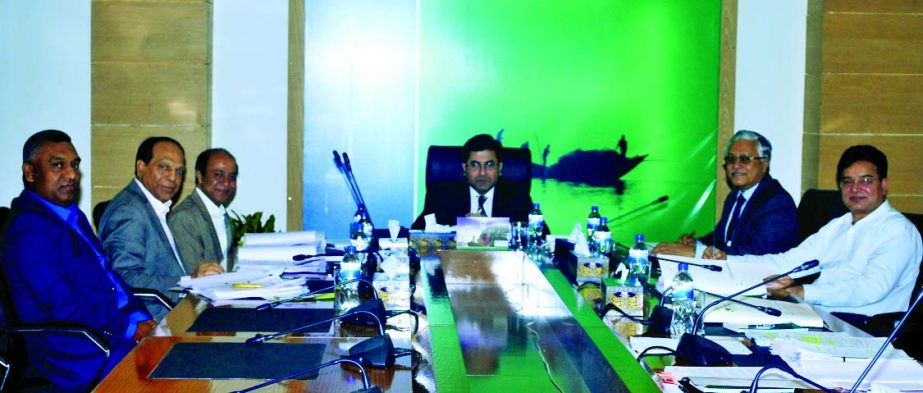 Barrister Sheikh Fazle Noor Taposh, MP, Executive Committee Chairman of Modhumoti Bank Limited, presiding over the 17th meeting of the bank at its head office on Monday.