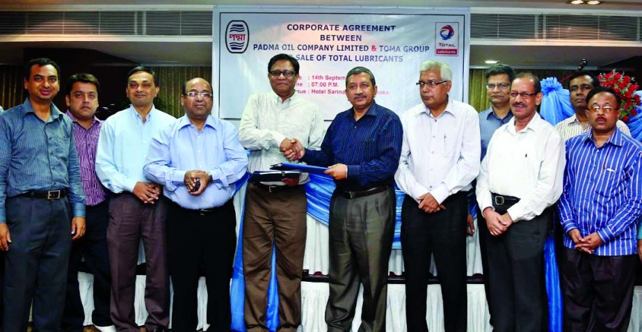 Kafiluddin Mahmud Chowdhury, General Manager of Padma Oil Company Limited and Imrul Quais, Director of TOMA Group signed an agreement recently to supply TOTAL Brand oil for TOMA Taxi Cab.