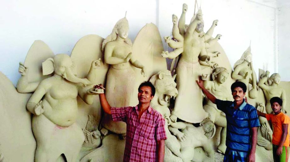 NARSINGDI: Idols markers in Narsingdi are passing busy time ahead of Durga Puja. This picture was taken on Wednesday.