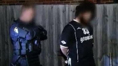 Police say that at least 15 people were arrested in the early morning raids