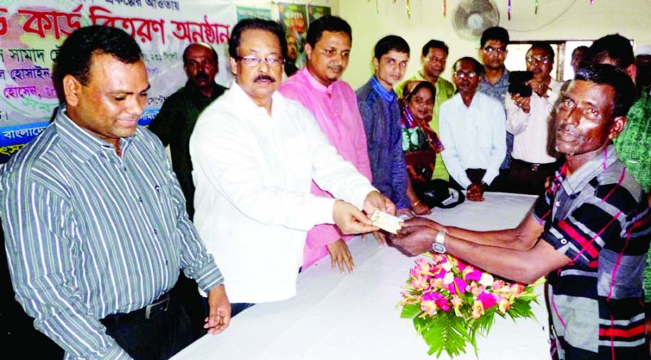 SYLHET: Mahmud-Us- Samad Chowdhury MP and Panel Speaker of the National Parliament distributing ID cards among fishermen organised by Fenchuganj Upazila Fisheries Department recently.