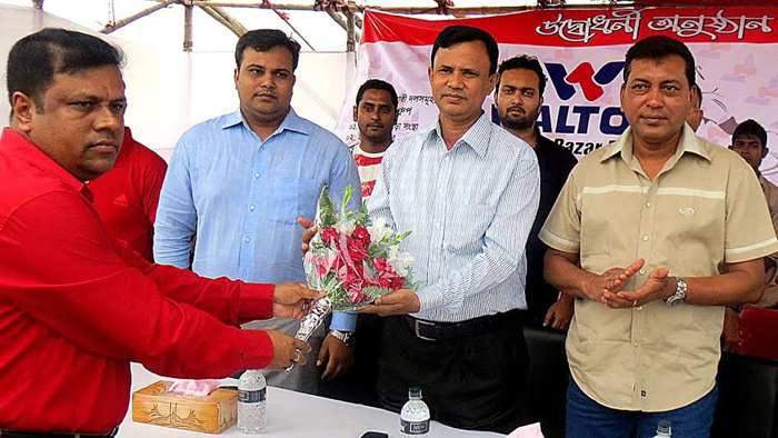 DC of Cox's Bazar district Md Ruhul Amin receiving bouquet at the Laboni Point in Cox's Bazar Sea Beach on Saturday.