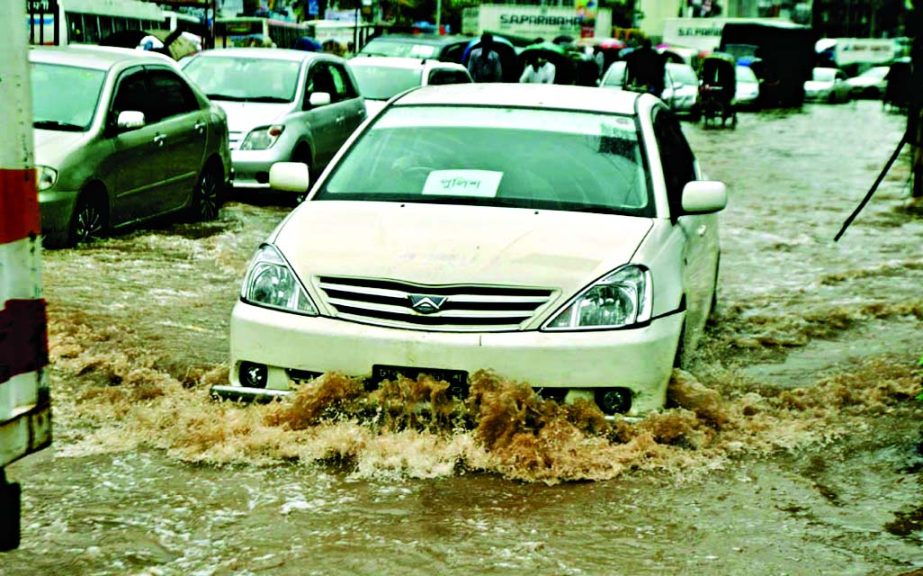 Movement of vehicles in many areas became near impossible as Saturday's day-long incessant rains water remained stagnant. This photo was taken from cityâ€™s Malibagh intersection.
