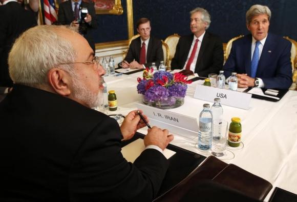 Iran's Foreign Minister Javad Zarif (L) holds a bilateral meeting with U.S. Secretary of State John Kerry (R) on the second straight day of talks over Tehran's nuclear program in Vienna
