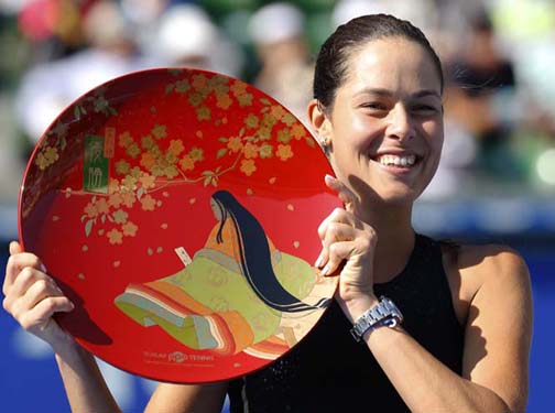 Ana Ivanovic of Serbia poses with a trophy after beating Caroline Wozniacki of Denmark in their final match to win the Pan Pacific Open Tennis tournament in Tokyo on Sunday.