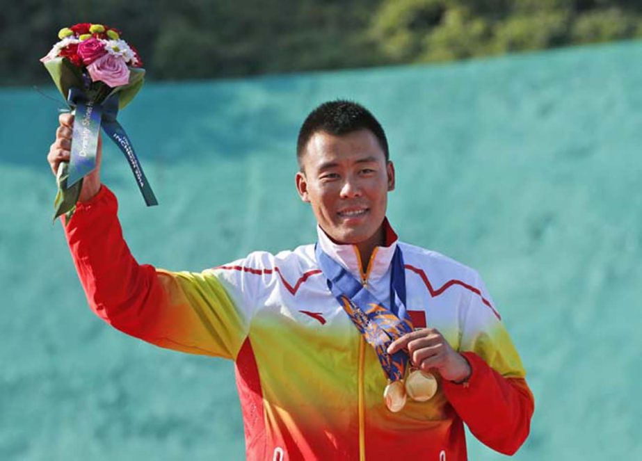 Chinaâ€™s Gao Bo celebrates after winning the gold medal of the men's trap shooting at the Gyeonggido Shooting Range for the 17th Asian Games in Incheon, South Korea on Sunday.