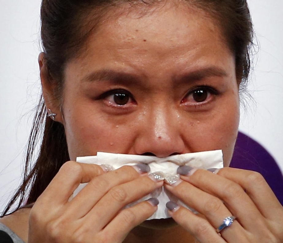 Chinese tennis player Li Na wipes her tears during a press conference to announce her retirement in Beijing, China on Sunday.