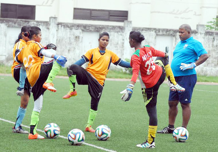 Members of Bangladesh Under-16 National Women's Football team stretching during their practice session at the BFF Artificial Turf on Sunday.