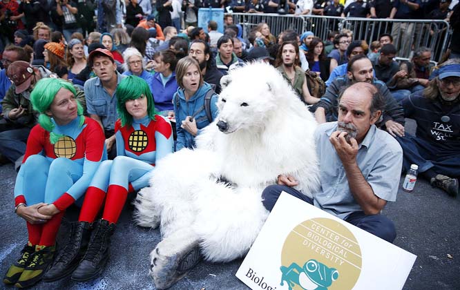 Protesters, including one dressed as a polar bear takes part in the "Flood Wall Street" demonstrations on preceding the United Nations's "Climate Summit 2014: Catalyzing Action" in New York.