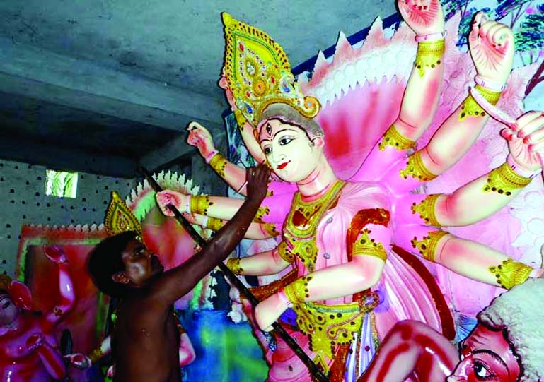 GOPALGANJ: Idols makers at Toungipara are busy for the last moment of work.