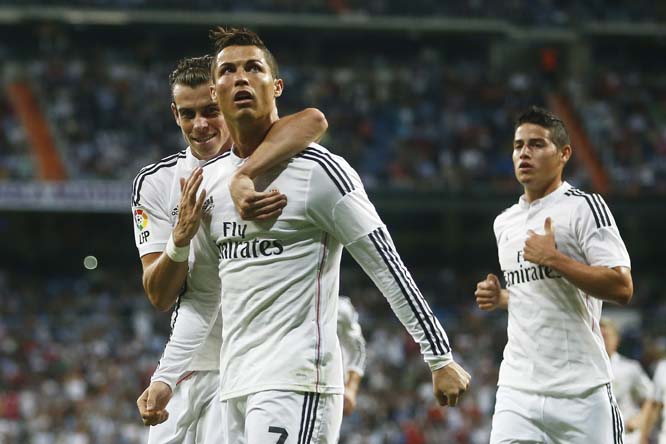 Real's Cristiano Ronaldo (second left) celebrates his goal with Real's Gareth Bale (left) during a Spanish La Liga soccer match between Real Madrid and Elche at the Santiago Bernabeu stadium in Madrid, Spain on Tuesday.