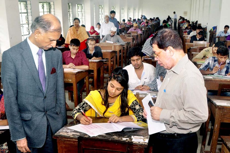 Dhaka University Vice-Chancellor Prof Dr AAMS Arefin Siddique visiting an examination hall of written test for admission into 1st year Honors' classes for the session 2014-2015 under Gha-Unit of the university held on Friday. Dean of the Faculty of Socia