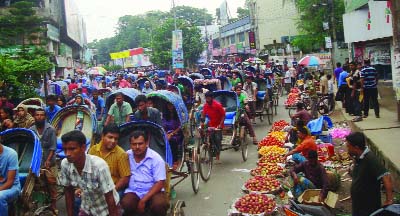 BOGRA: Traffic jam has become frequent in Bogra town recently due in absence of traffic police . Everyday passengers have to suffer three to four hours for jam. This picture was taken from Zero Point of the town on Tuesday.