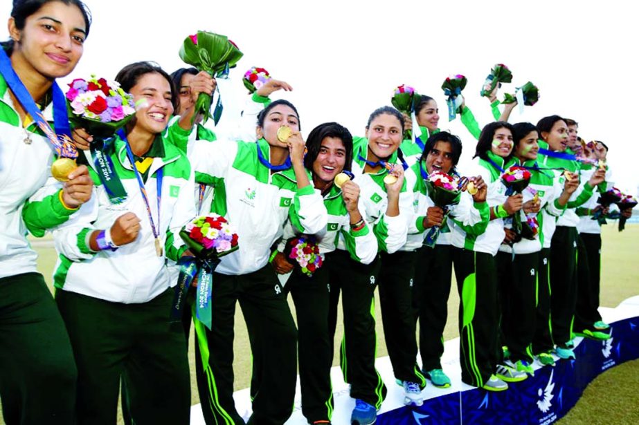 Players of Pakistan Womenâ€™s Cricket team celebrate with their gold medals after beating Bangladesh in the Asian Games cricket final at the Yeonhui Cricket Ground on Friday.