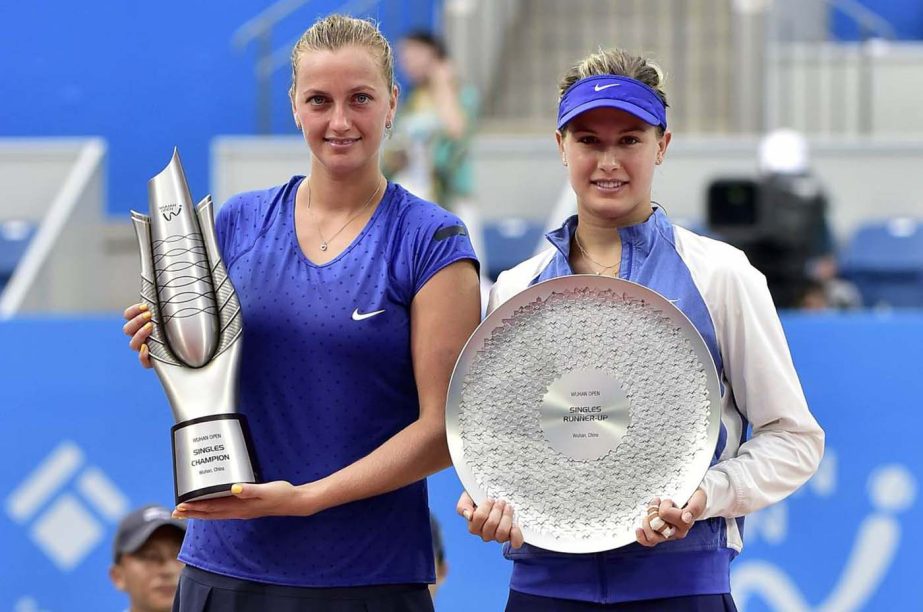 Petra Kvitova of the Czech Republic (L) and Eugenie Bouchard of Canada pose for photographs with their trophies after the women's singles final match at the Wuhan Open Tennis Tournament in Wuhan, Hubei province on Saturday. Kvitova beat Bouchard 6-3, 6-4