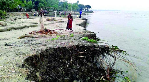 Second spell of flash flood, triggered by heavy rains, washed away major portion of Jamuna embankment at 40 points in Fulchhari, Saghata upazilas in Gaibandha. This photo was taken on Saturday. Banglar Chokh