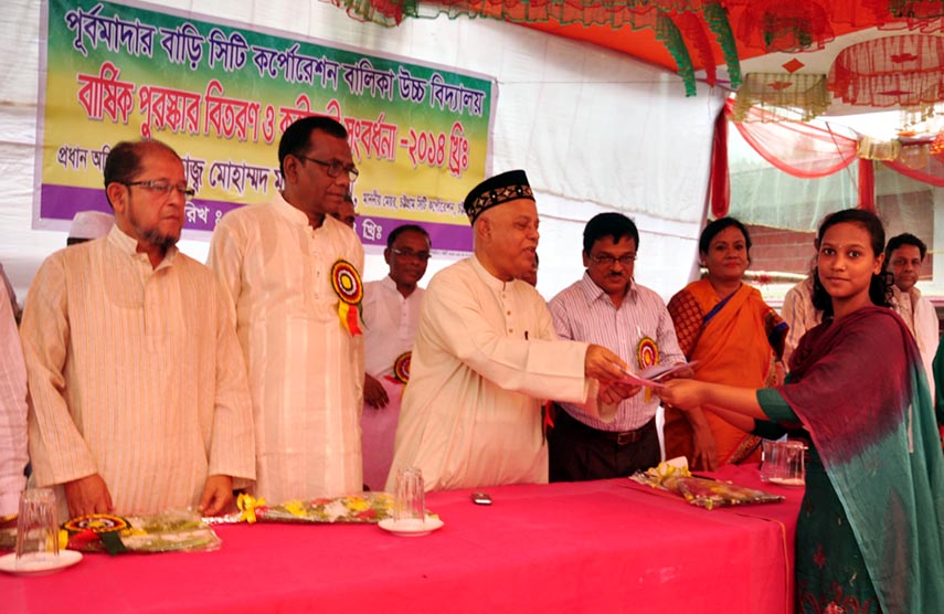 CCC Mayor M Monzoor Alam distributing prizes among the winners of annual prize-giving ceremony of Purbmadarbari City Corporation Girls' High School at Chittagong yesterday.