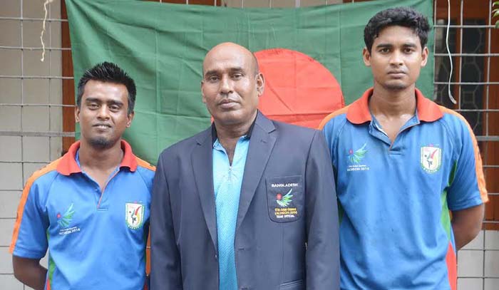 Members of Bangladesh National Karate team pose for a photo session in the city on Sunday before leaving for Incheon of South Korea to take part in the Karate Competition of the 17th Asian Games.