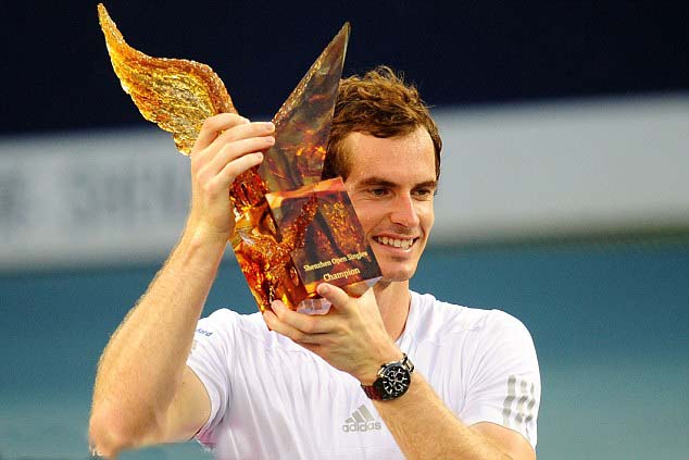 Andy Murray raises his trophy after winning the men's singles final match against Tommy Robredo.
