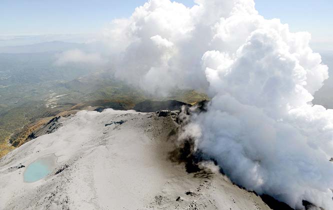 Volcanic smoke and fume raising from craters of Mount Ontake, central Japan.